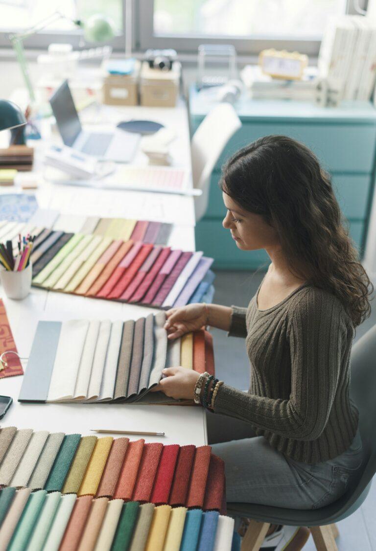 Young interior designer choosing fabric samples